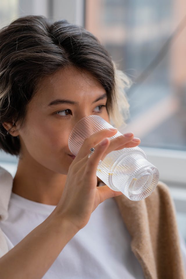 drinking a glass of water